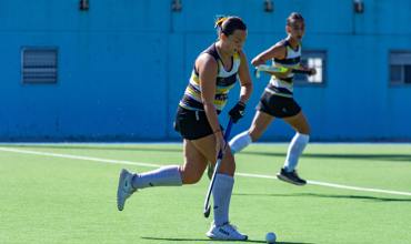 Camogie player catching the sliotar