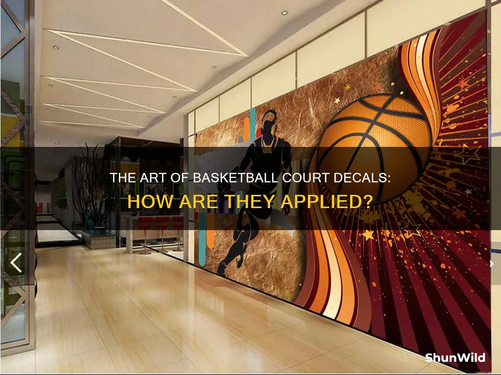 how do they put decals on basketball floors