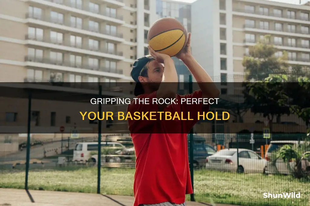 how do you hold a basketball