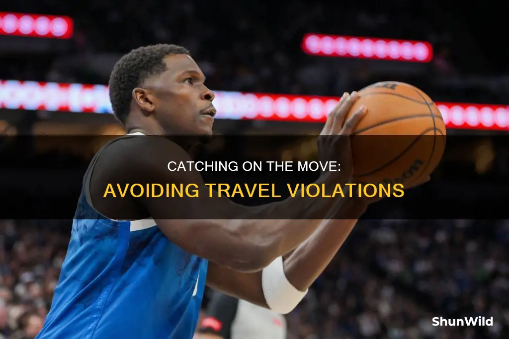 how to catch a basketball while moving and not travel