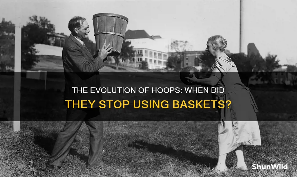 when did they stop using baskets in basketball