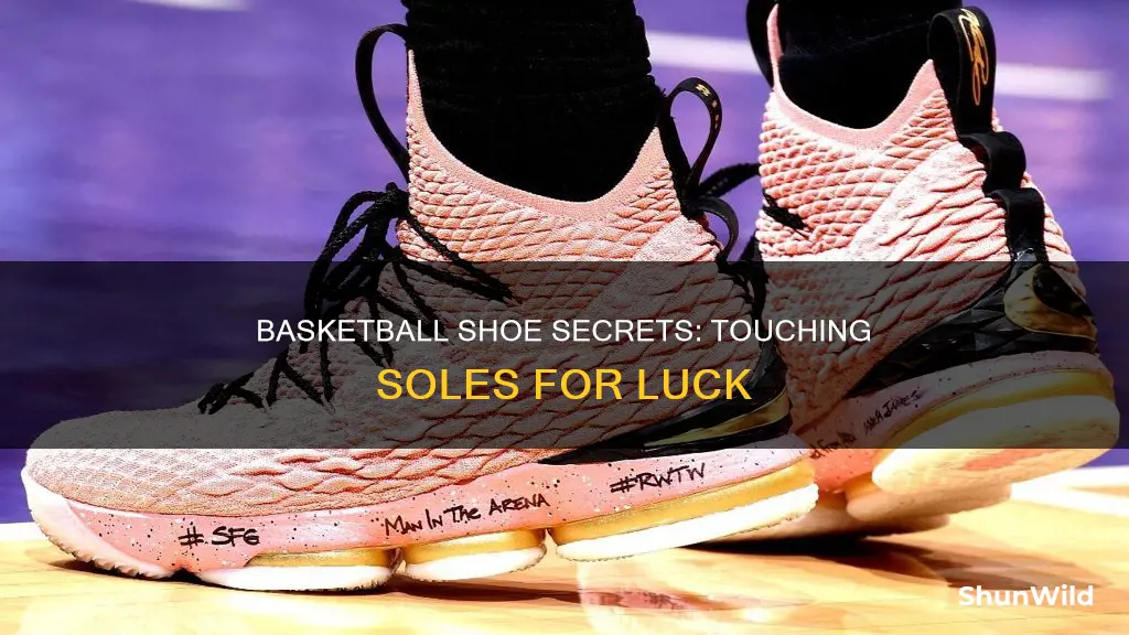 why do basketball players touch the bottom of their shoes